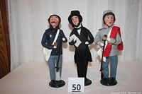 Three figures side by side: Union soldier (left), Abraham Lincoln (center), Confederate soldier (right) on white background