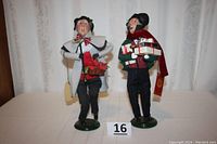 Front view of both Scrooge figurines together on table