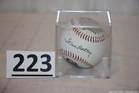 Clear view of the baseball inside a plastic display cube showcasing Steve Carlton's printed signature.