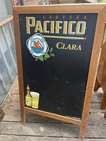Front view of the wooden framed chalkboard featuring Cerveza Pacifico Clara branding with bottle and glass image on bottom left.