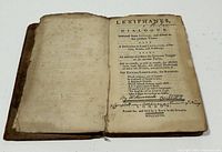Photo of open title page of 1767 Lexiphanes book showing printed title and handwritten notes, demonstrating age and condition of pages.