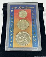 Three 1976 US Bicentennial coins layered with 24kt gold displayed in a clear protective case with blue and gold background text