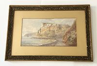 Framed coastal cliffs watercolor painting by Arthur W. Perry, showing full piece including ornate frame and matting.