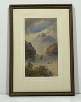 Full view of framed watercolour painting showing landscape with mountains, water, boats, and vegetation in the foreground.