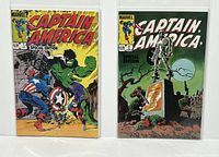 Front view of Marvel Captain America Special Edition Issue #1 and #2 comics side by side in protective sleeves.