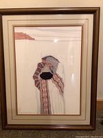 Full view of framed watercolor painting showing three figures and adobe landscape