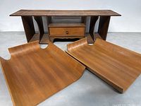 Front view of the wooden desk organizer shelf with two wooden desk trays in front.