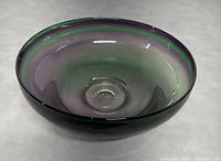 Image showing top view of the shallow rounded bowl with smooth outer surface and gradient purple-green coloration.