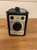 Front view of Coronet Ambassador camera showing the lens and two viewfinder windows at the top.