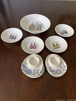 Top down view of 5 Melitta bowls and 5 Figgjo egg cups laid out on table