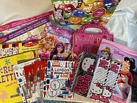 Assortment of colouring and sticker books and kits including Hello Kitty journals, Disney Princess book, Melissa & Doug pads, London doodling and Popstar books.