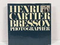 Front cover of the Henri Cartier Bresson Photographer book; dark blue with large white and black text and a small photo inset.