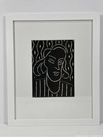 Full view of framed linoleum engraving showing the entire artwork with white mat and frame.