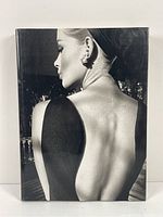 Front cover of the photography book showing a black and white profile portrait of a woman with exposed back.