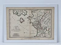 Photo showing entire antique engraved map with visible hand-colored border lines and legend.