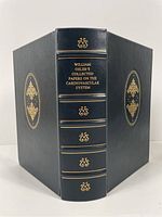 Front, back, and spine of the book showing full leather cover and gilt decorations.