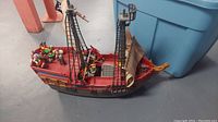Full assembled view of the Playmobil pirate ship with pirate figurines on deck.