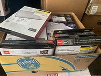 Box containing multiple boxed RCA flat digital indoor HDTV antennas.