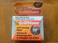 Original packaged GrillStone Grill Cleaning Block showing product details and branding.