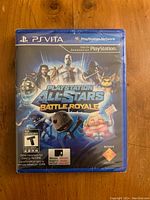 Front cover photo of the PlayStation Vita game PlayStation All-Stars Battle Royale showing the original sealed packaging and cover art.