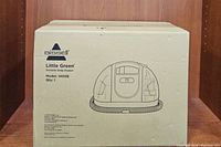 Front view of the original box showing Bissell brand, Little Green model, and model number 1400B. Box depicts the portable deep cleaner design and Bissell company details.
