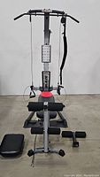 Front view of Bowflex Blaze machine with cables, seat, and base