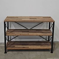 Front view of the 3-tier rustic wooden console table with metal frame showing three wooden planks and two shelves.