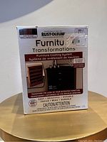 Front of box showing Rust-Oleum Furniture Transformations resurfacing kit for furniture and cabinetry, dark base, covering 35 sq ft.