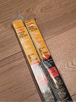 Two 6-outlet metal hardwired outlet extender strips in original packaging, yellow and black labels visible.