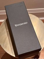 Black Waterford box for the decanter, showing branding.