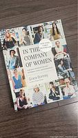 Top cover view of 'In the Company of Women' by Grace Bonney, showing colorful portraits of women on the cover.