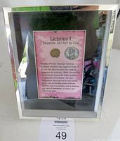 Framed coin with label showing historical description about Emperor Licinius I and his reign from 307 to 324 AD. The frame is silver-colored and the backing is pink with black text.