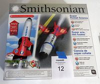 Box front showing images and details of the Smithsonian Super Rocket Science kit, featuring the rocket and rocket car with specifications and features.