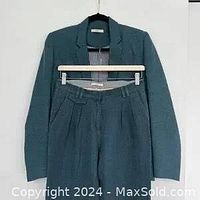 Front view of the Sessun Bliss Li blazer and ankle pants suit set hung on hangers showing the color and material texture.