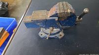 Side view of 3-inch swivel bench vice showing paint chipping and wear.