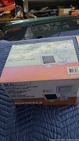 Box of Sunforce 100 LED Solar Motion Activated Outdoor Light showing product name, image, and some features.