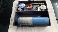 Photo showing entire propane soldering kit with canister inside case