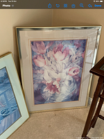 Framed picture of floral theme with pink tulips in a glass vase in pastel shades