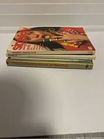 Photo of three stacked sewing books showing their spines and part of their covers.