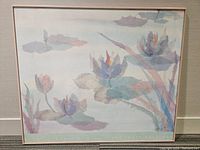 Front view of the framed print showing the watercolor lily pads and flowers in pastel colors