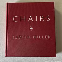 Front cover of the book, showing title 'CHAIRS' and author name 'JUDITH MILLER' on textured red cover.