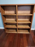 Full frontal view of the double bookshelf unit.
