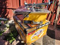 Workforce 7-inch tile wet saw on top of its original box with product images and brand name visible.