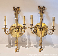 Photo showing both matching brass wall sconces side by side, frontal view.