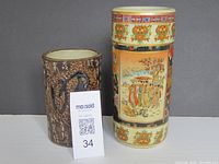 Front view photo showing both Asian vases side by side for size comparison.