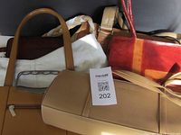 Group of 6 bags in different colors and styles showing light use