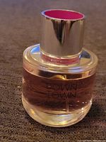 Full view of the Downtown Calvin Klein Eau de Parfum bottle showing shape, color, and cap detail.