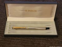 Vintage Parker pen displayed inside original case with cream interior lining and gold Parker logo.