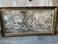 Full view of the framed tapestry showing the entire pastoral scene with children and animals in a landscape setting.