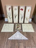 Full display of all 8 decorative wall art pieces showing overall condition and arrangement